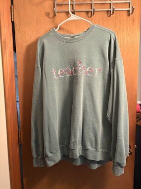 Comfort Colors sage green crewneck with embroidered floral text
